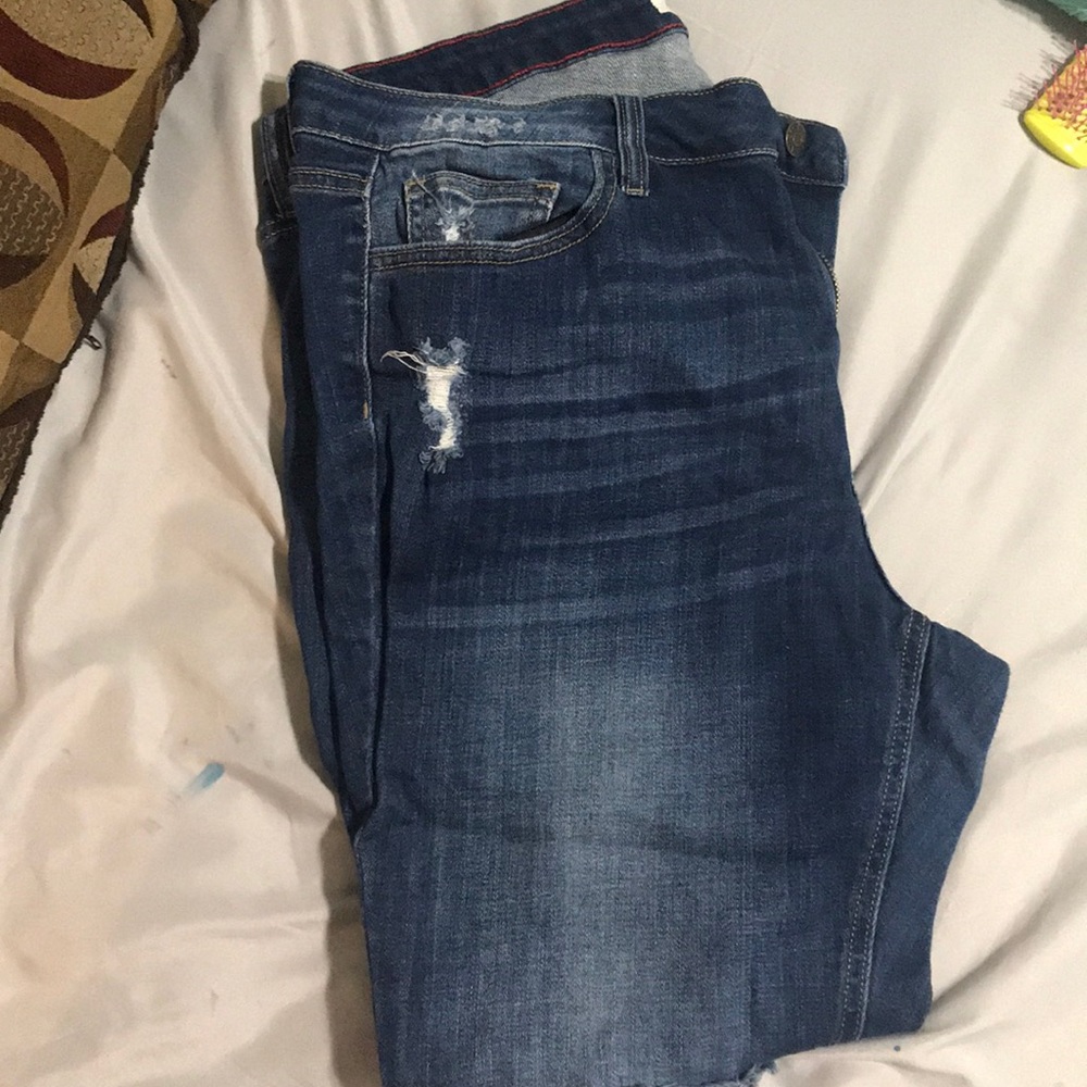 Distressed blue jeans plus size woman
